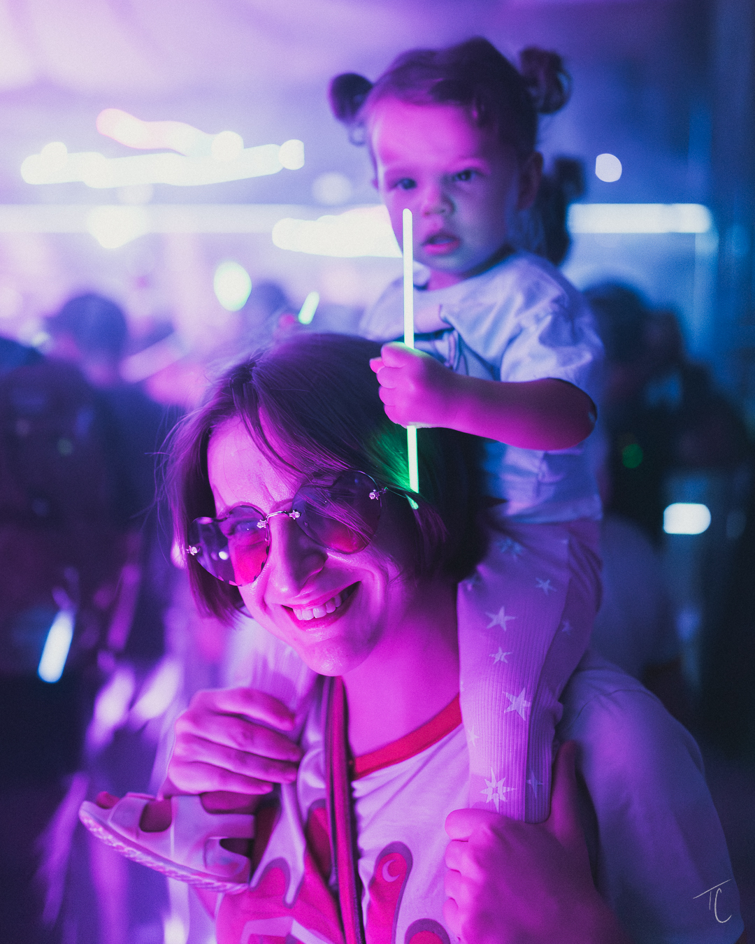Girl with heart sunglasses at glow party