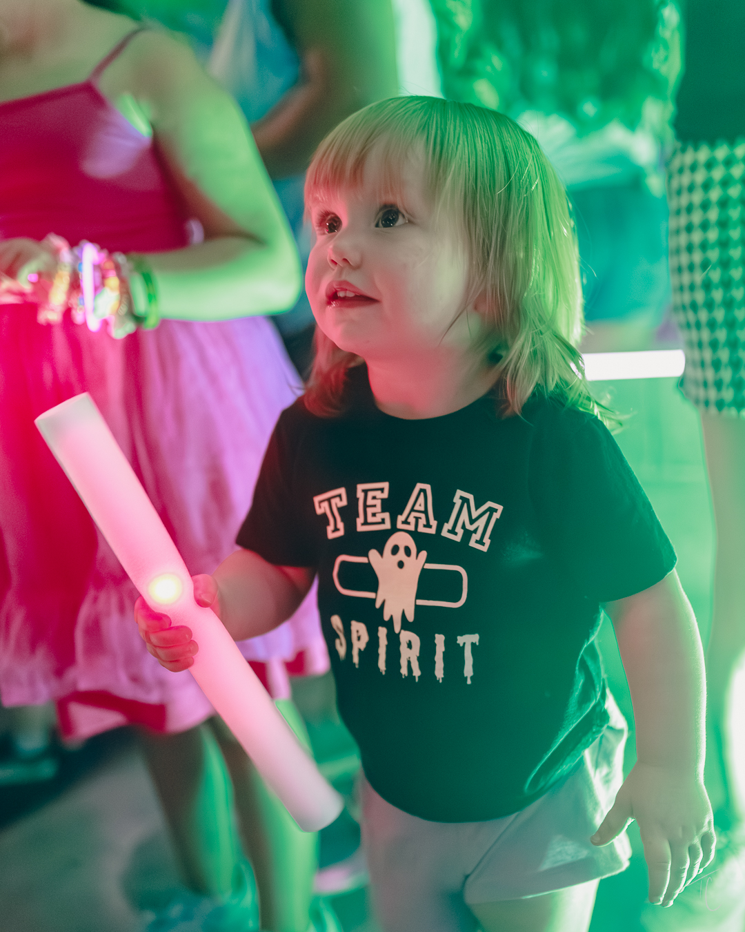 Girl with glow stick at LRS event